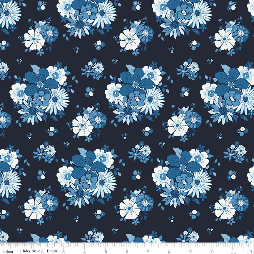 Floral pattern with blue and white flowers on a navy background, featuring a fabric swatch with measurements.