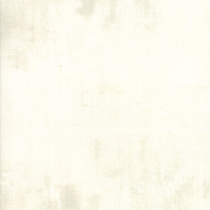 A square swatch of textured cream or off-white material with subtle mottled gray-beige variation.
