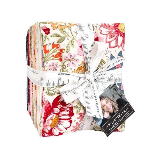Pack of floral fabric squares with a ruler and Moda label on a white background