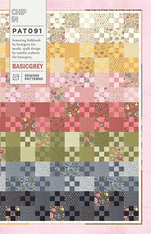 Quilt pattern with various colored squares on a pink border, featuring the brand 'BasicGrey'.