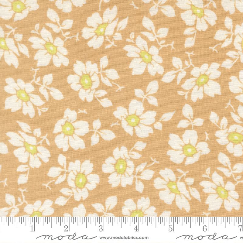 Floral fabric pattern with a ruler for scale on a beige background