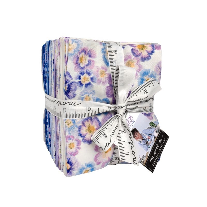 Pack of fabric strips with floral pattern and measuring tape, brand 'Moda' visible