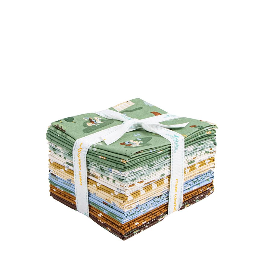 Stack of fabric squares tied with a white ribbon on a white background