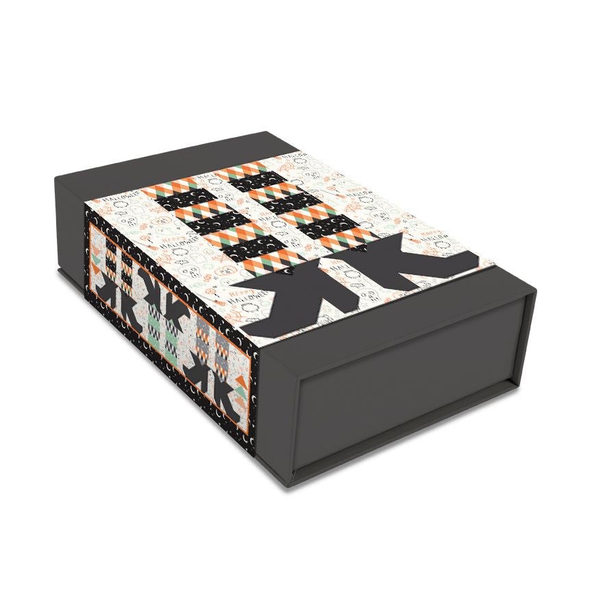 Decorative box with geometric pattern on a white background and a set of witches feet.