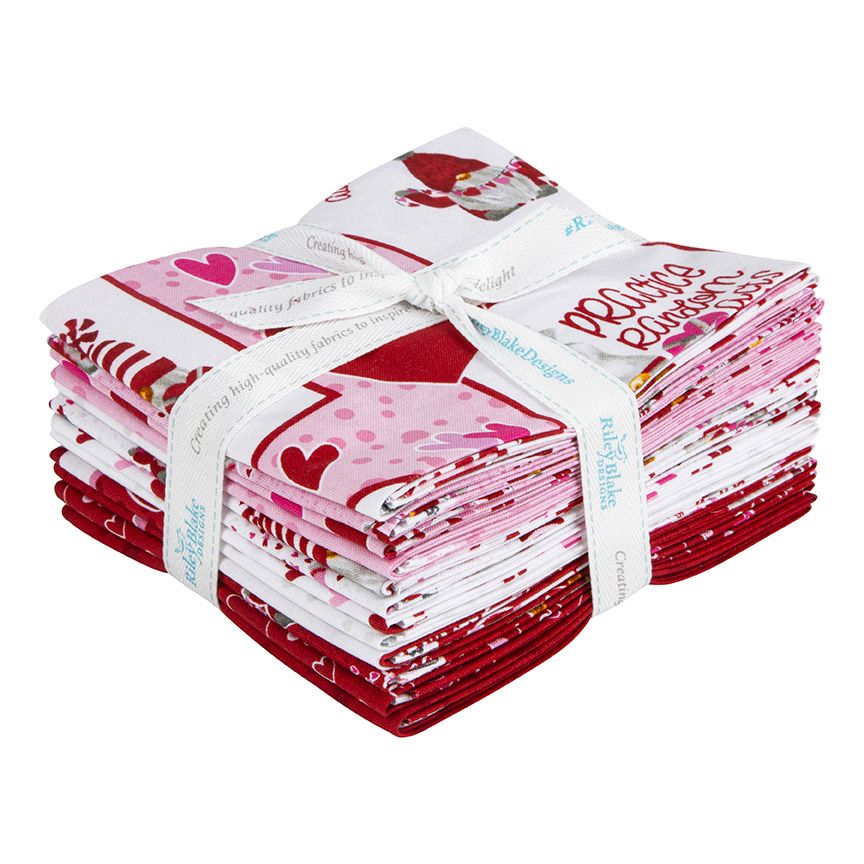 A bundle of 12 quilt fabrics from the  Gnomes In Love collection, tied with a white branded ribbon. The fabrics feature whimsical gnome characters, hearts, florals, and playful coordinates in a sweet Valentine-inspired palette of reds, pinks, and neutrals.