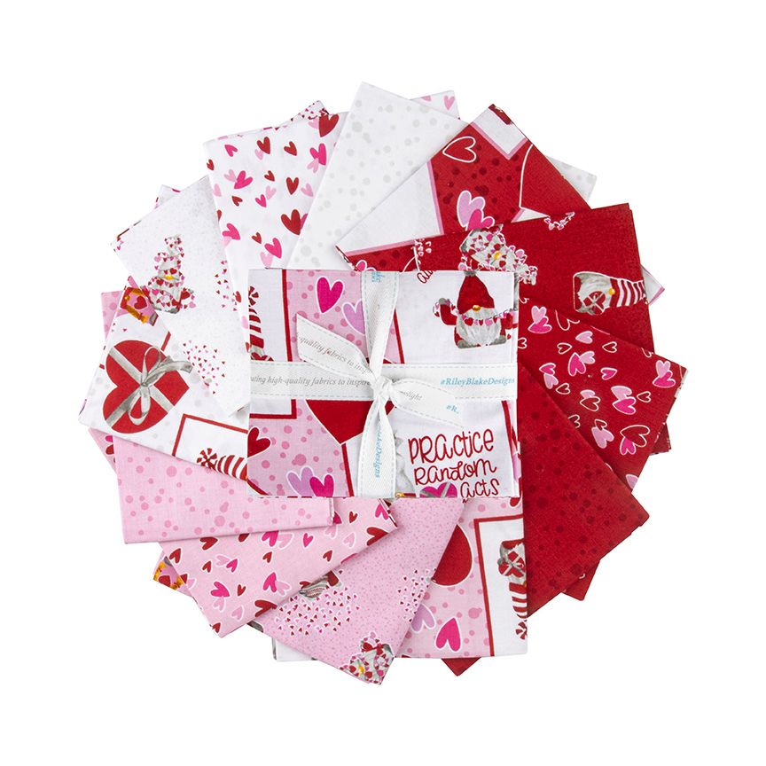 A circular arrangement of red, pink, and white Valentine's Day themed fabric scraps tied together with a white ribbon. The fabrics feature various patterns including whimsical gnome characters, hearts, florals, and playful coordinates in a sweet Valentine-inspired palette of reds, pinks, and neutrals.