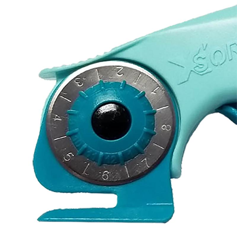 Close-up of a turquoise and gray rotary cutter showing the dials and part of the handle on a white background.