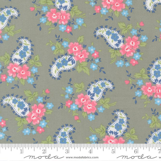 Floral and paisley pattern fabric with a ruler at the bottom