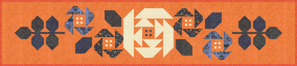 A Halloween-themed quilted table runner with geometric shapes on an orange background