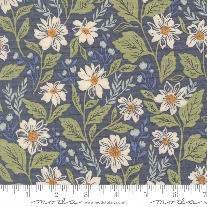 Floral fabric pattern with white flowers and green leaves on a blue background, featuring Moda label.