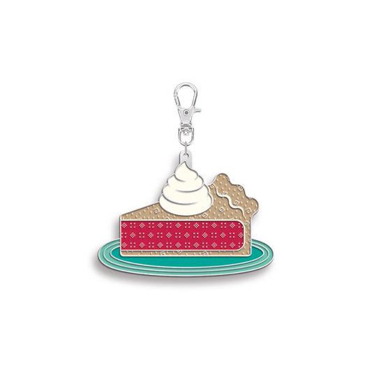 Zipper charm shaped like a slice of pie with whipped cream on a white background