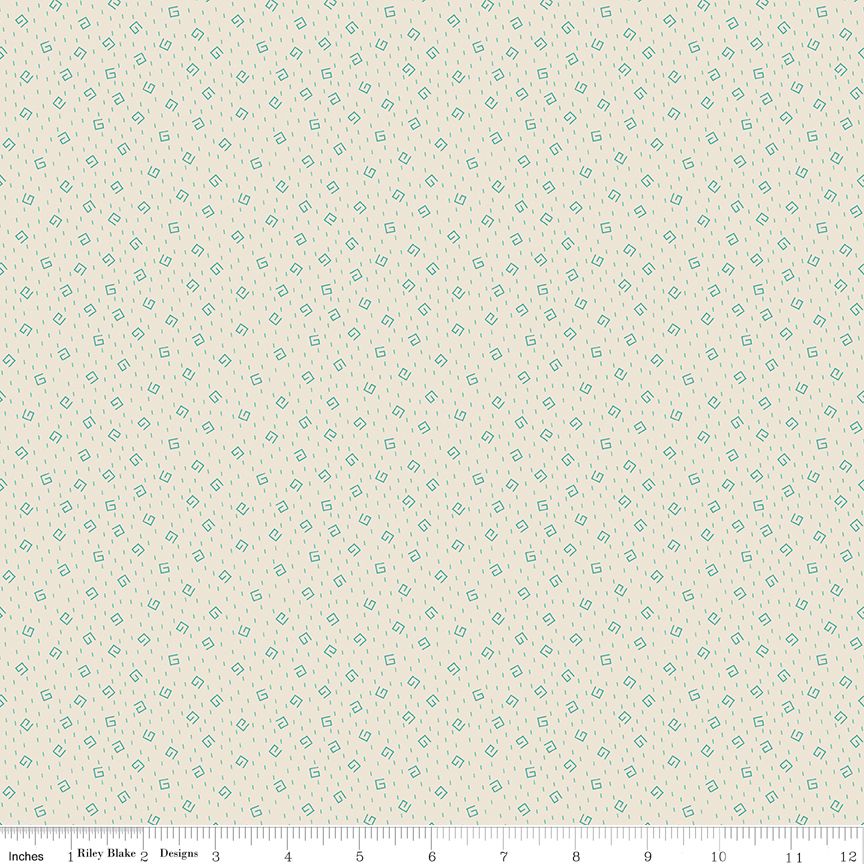 Cream fabric with printed 'doodles" in light blue and a ruler at the bottom.
