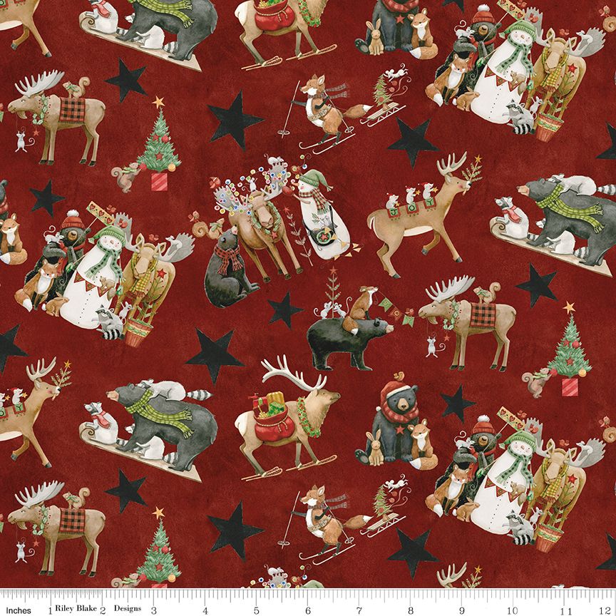 Christmas-themed fabric with reindeer, snowmen, and stars on a red background.