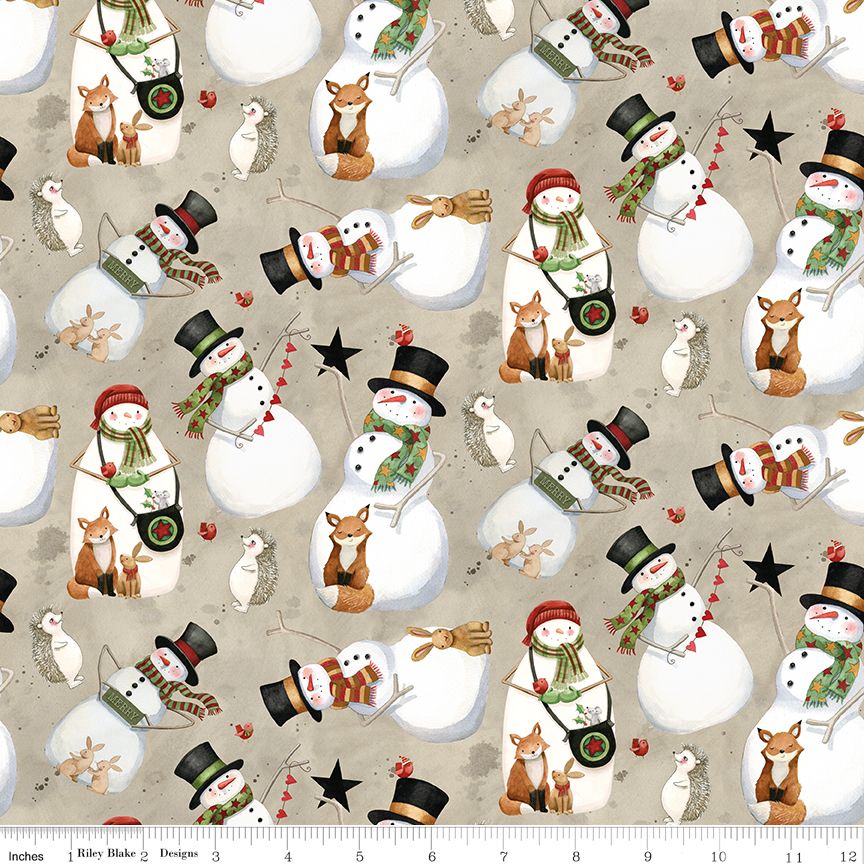 A repeating fabric pattern featuring illustrated snowmen, foxes, owls, and small holiday motifs on a warm beige background, with a ruler edge visible along the bottom for scale.