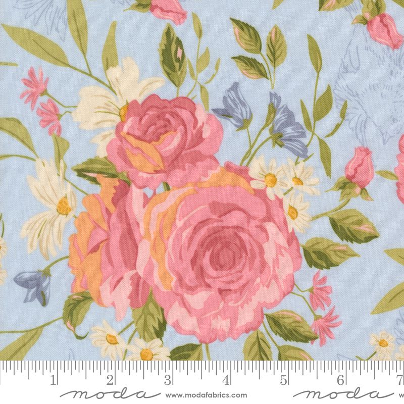 Floral fabric pattern with pink roses and green leaves on a light blue background, featuring Moda label.