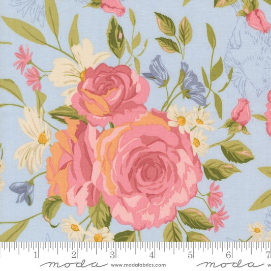 Floral fabric pattern with pink roses and green leaves on a light blue background, featuring Moda label.