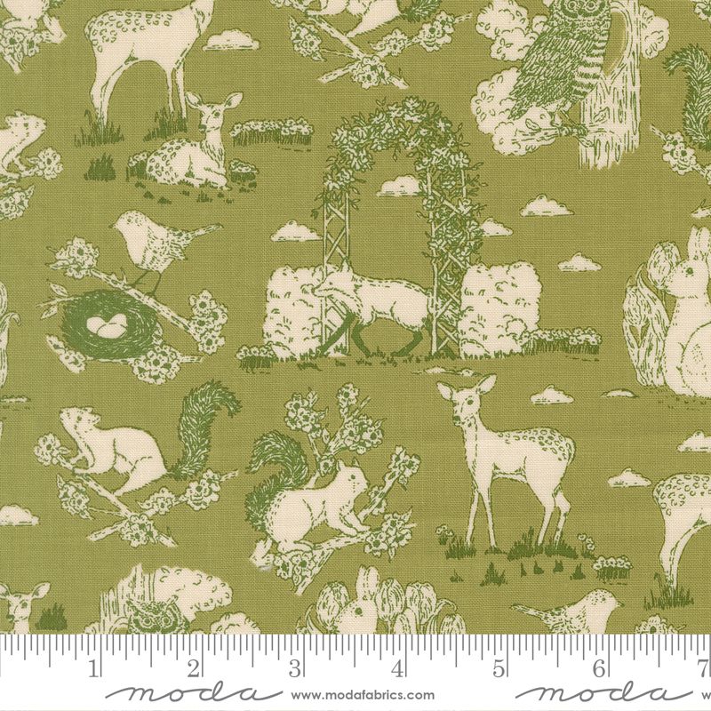 Fabric with nature-themed pattern featuring animals and plants on a green background, with a ruler at the bottom.