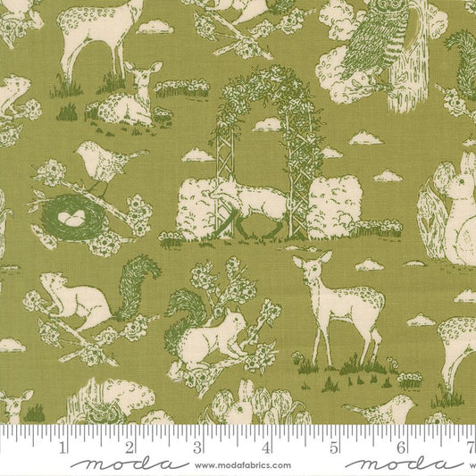 Fabric with nature-themed pattern featuring animals and plants on a green background, with a ruler at the bottom.