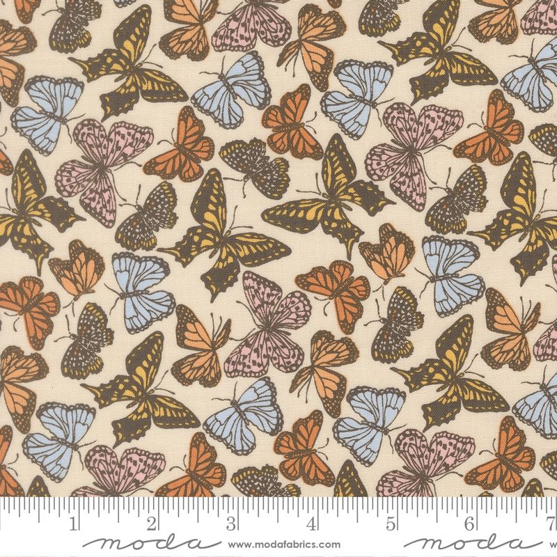 Butterfly pattern fabric with a ruler for scale, featuring Moda brand.
