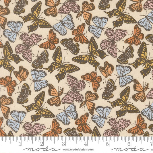 Butterfly pattern fabric with a ruler for scale, featuring Moda brand.