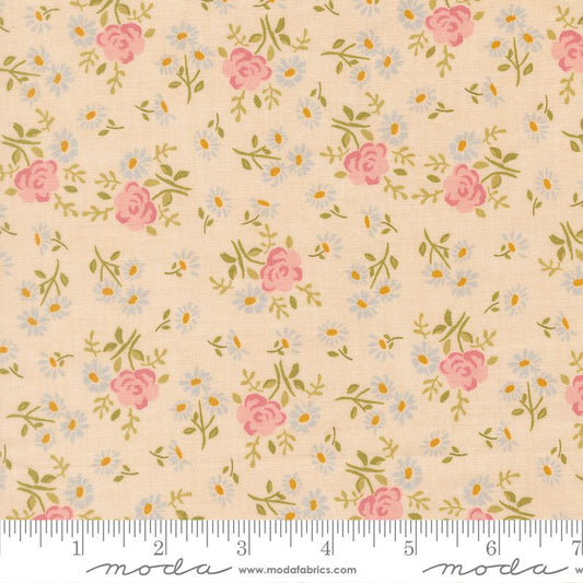 Floral pattern fabric with pink roses and green leaves on a cream background, featuring Moda label.
