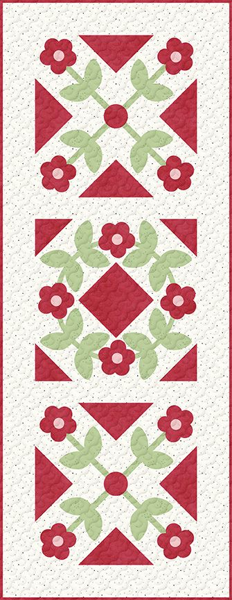 A quilted patchwork runner featuring three stacked floral blocks with red flowers, green leaves, and red triangles on a cream speckled background, bordered by a red stripe.
