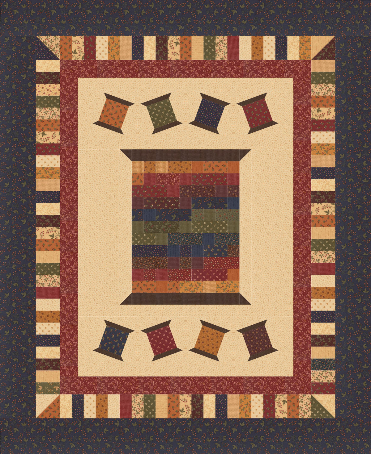 A quilted patchwork design featuring a central spool motif with a multicolor patchwork body, surrounded by cream and burgundy borders, and small hanging pennant shapes above and below. The outermost border is dark navy with a subtle floral pattern.