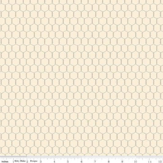 Cream fabric with gray chicken wire pattern and a ruler at the bottom for scale.