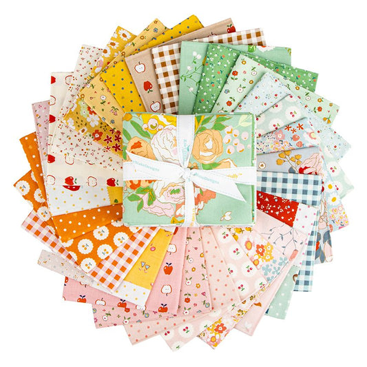 A circular arrangement of folded fabric squares in assorted floral, gingham, polka dot, and pastel patterns, with a central folded bundle tied in a white bow. The fabrics display colors including pink, green, yellow, orange, blue, and white on a plain white background.