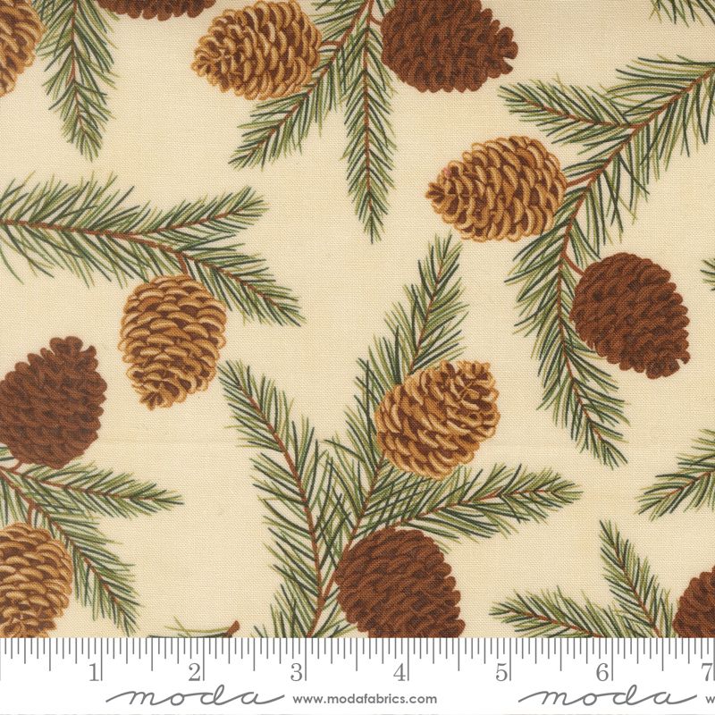 Fabric pattern with pinecones and branches on a cream background, featuring Moda label.