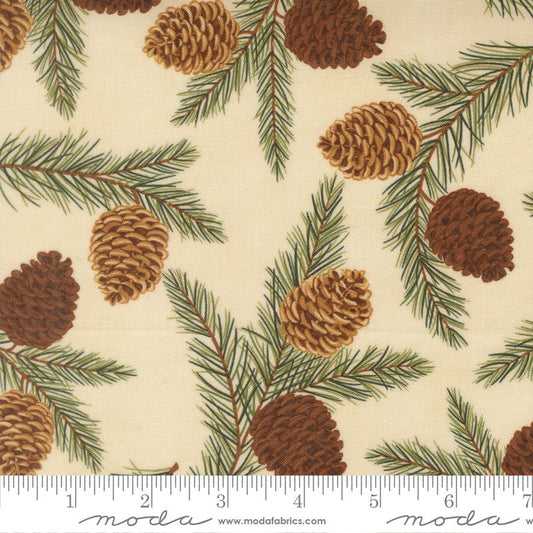 Fabric pattern with pinecones and branches on a cream background, featuring Moda label.