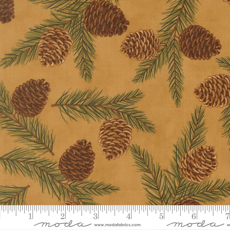 Fabric with pine cones and branches pattern on a beige background, featuring Moda label.