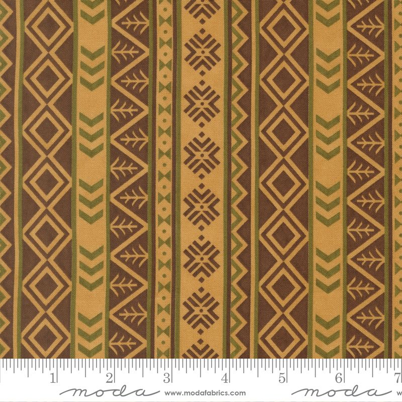 Fabric with geometric pattern and ruler for scale, featuring brown and beige colors.