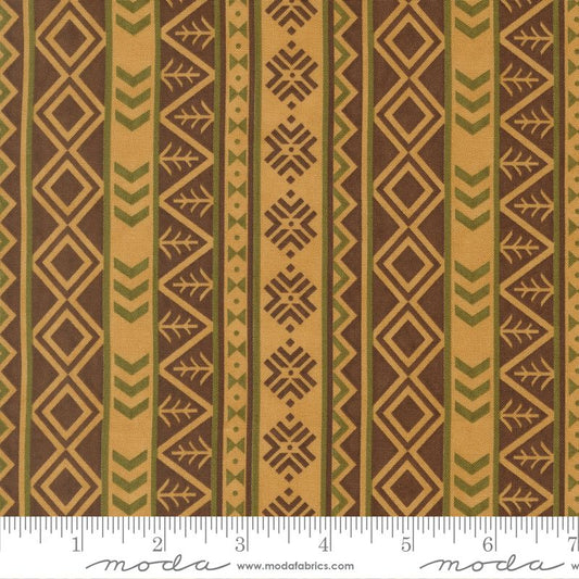 Fabric with geometric pattern and ruler for scale, featuring brown and beige colors.