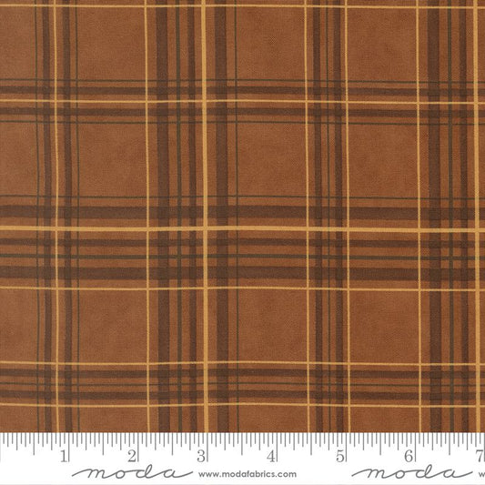 Brown plaid fabric with a ruler at the bottom for scale, featuring the Moda Fabrics logo.