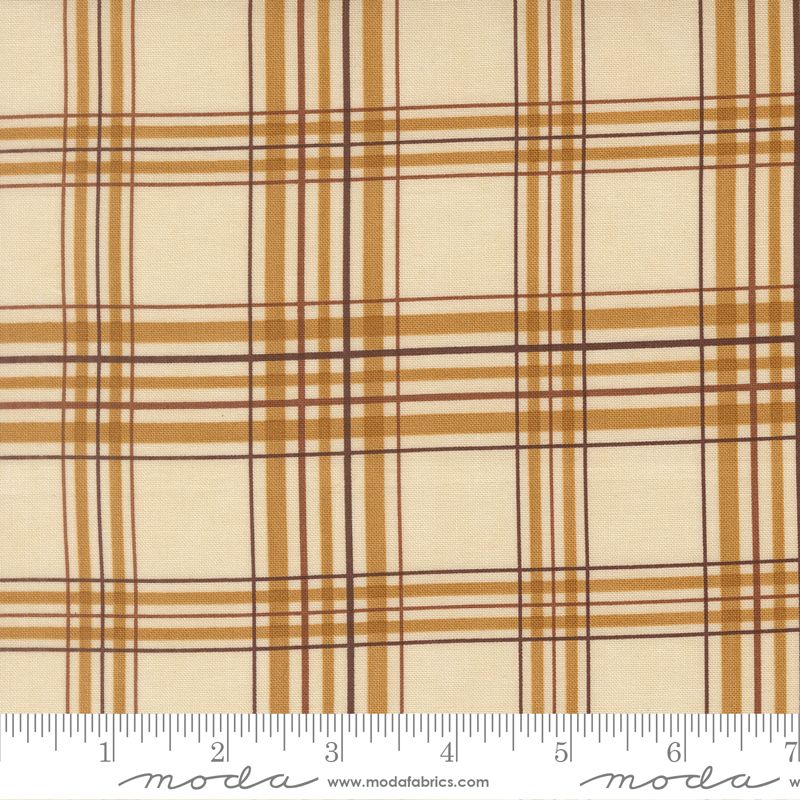 Plaid fabric with brown and cream pattern on a white background, featuring Moda label.