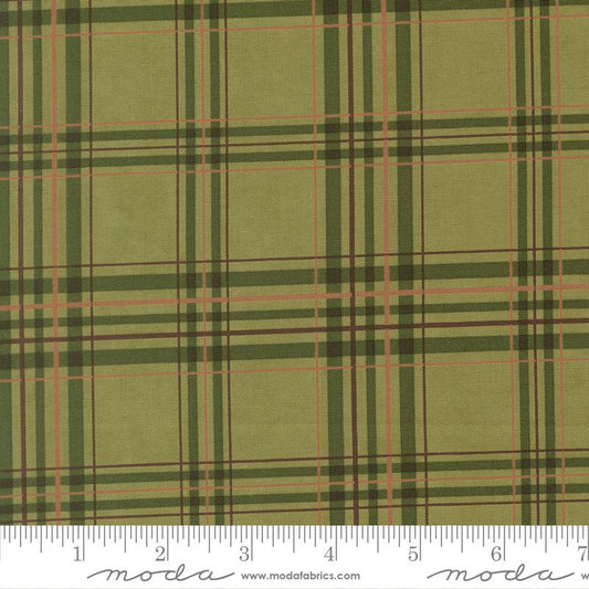 Green plaid fabric with a ruler for scale, featuring the Moda Fabrics logo.