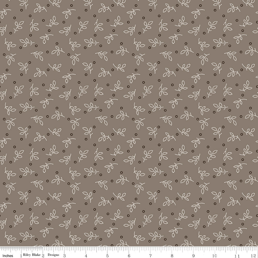 This fabric print features pixelated leaves and circle dots in a grey colorway from Gentler Times by Lori Holt of Bee in my Bonnet for Riley Blake Designs