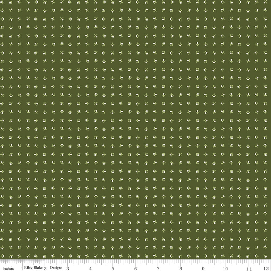 Green fabric with an array of geometric flowers.