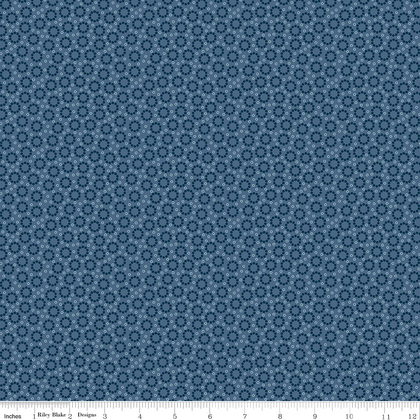 Blue fabric with blossoms and circle dots.
