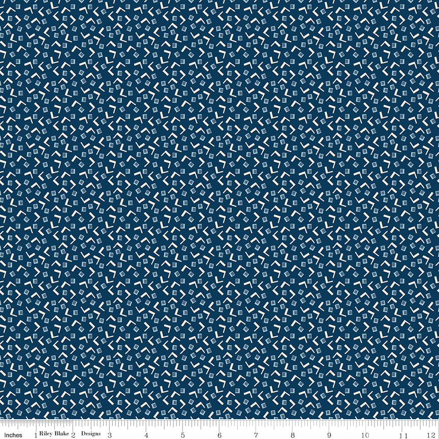 Navy fabric with small squares and V shapes.