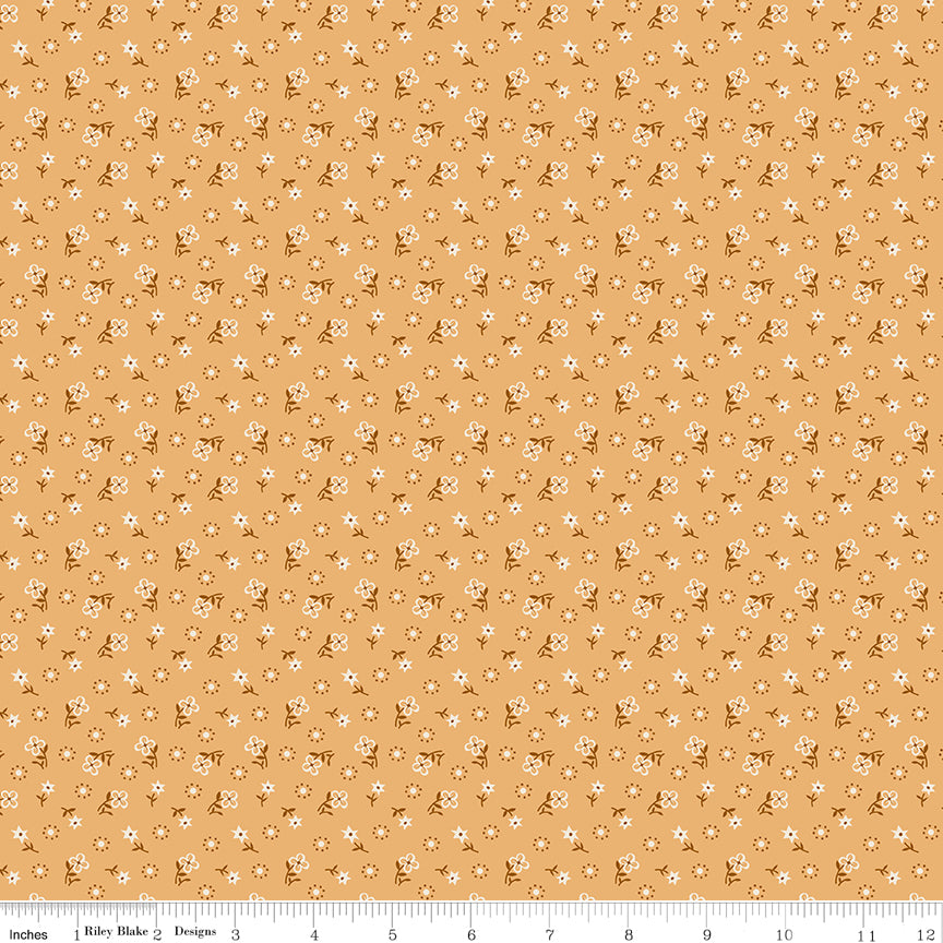 Yellow fabric with flower stems and a geometric dot design.