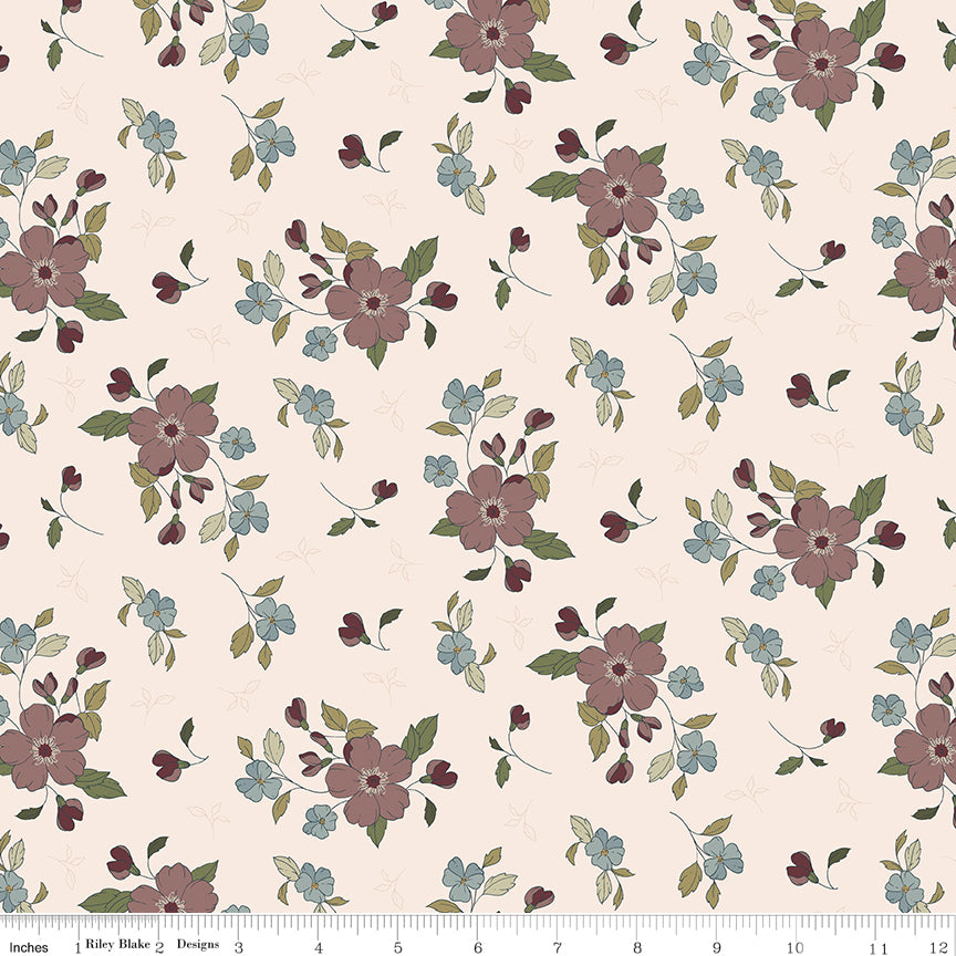 Tan fabric with sprigs of flowers and leaves.