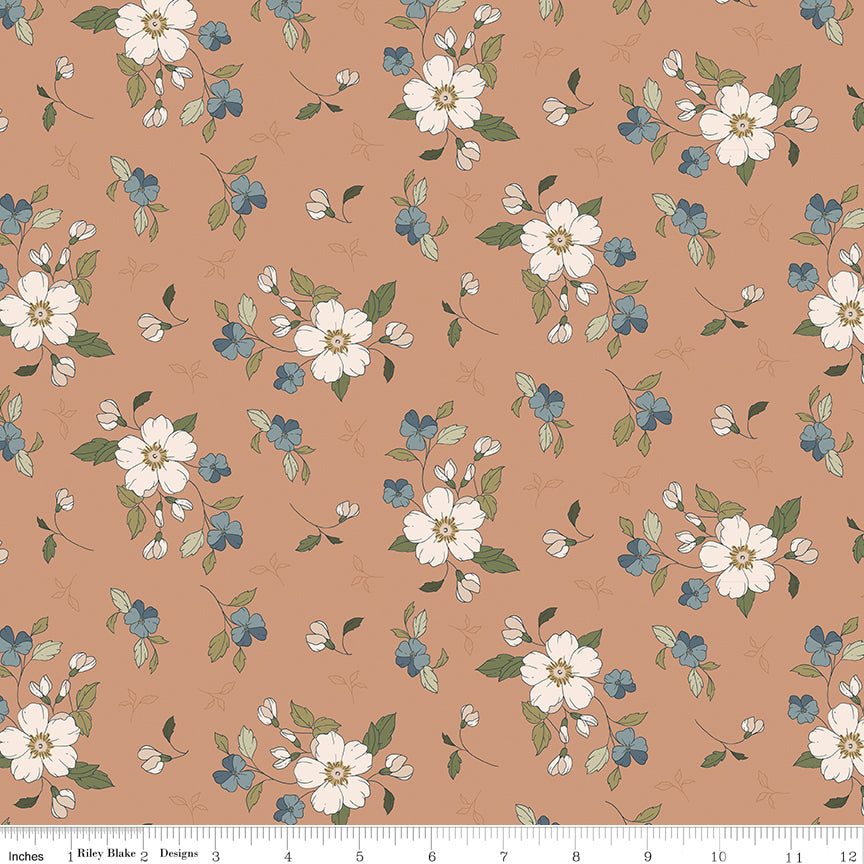Coral fabric with sprigs of flowers and leaves.