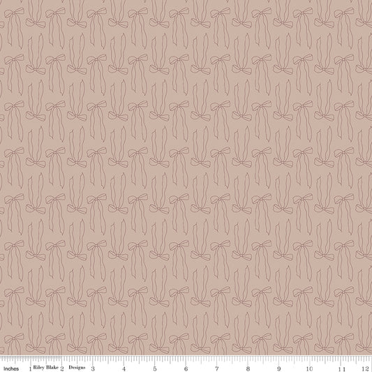 Brown fabric with line-drawn bows.