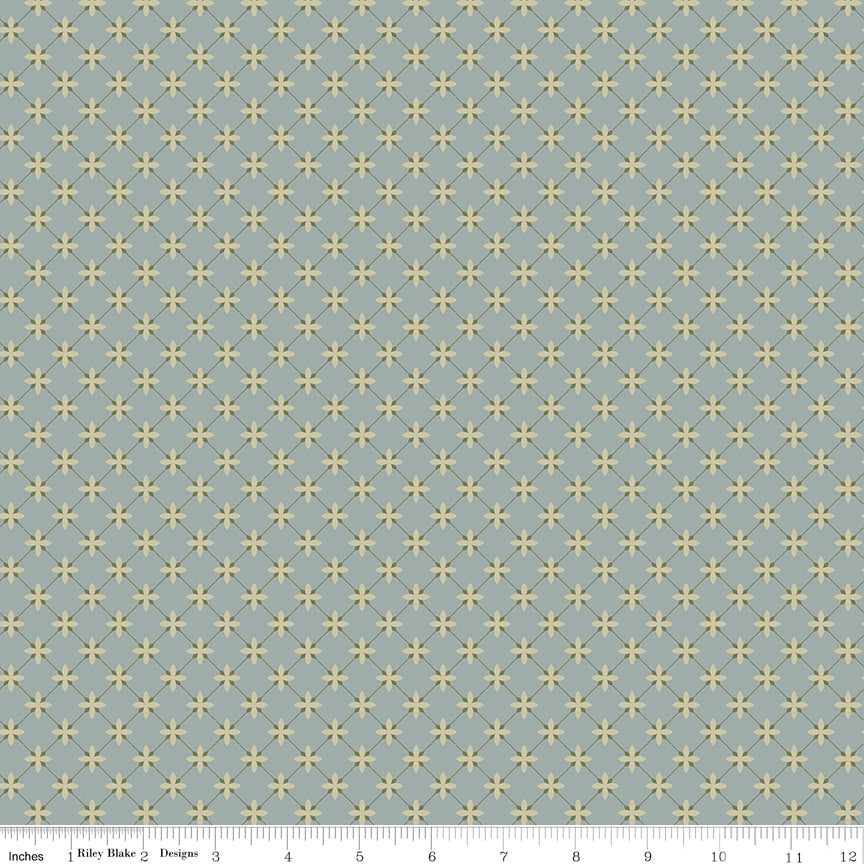 Blue fabric with a lattice grid with petals at the intersections.