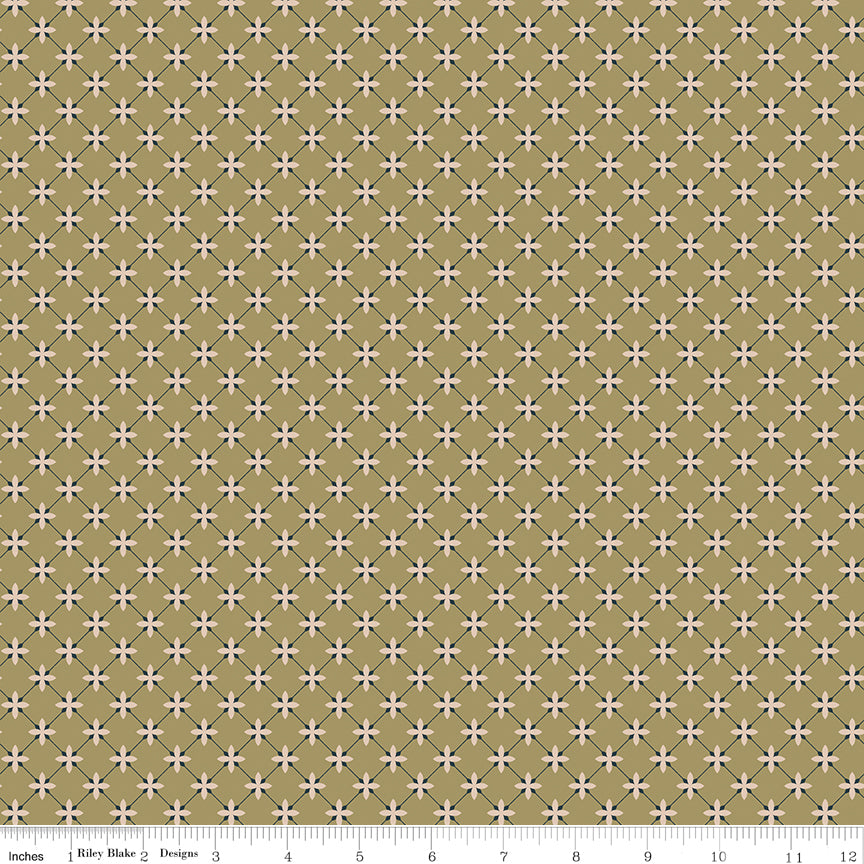Green fabric with a lattice grid with petals at the intersections.