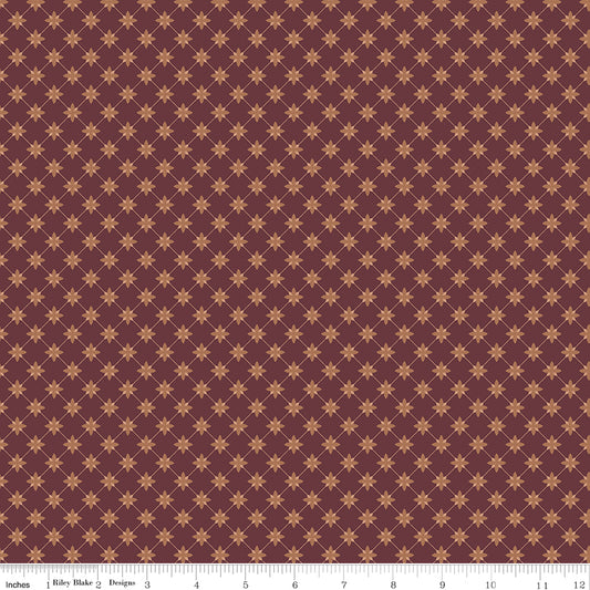 Red fabric with a lattice grid with petals at the intersections.