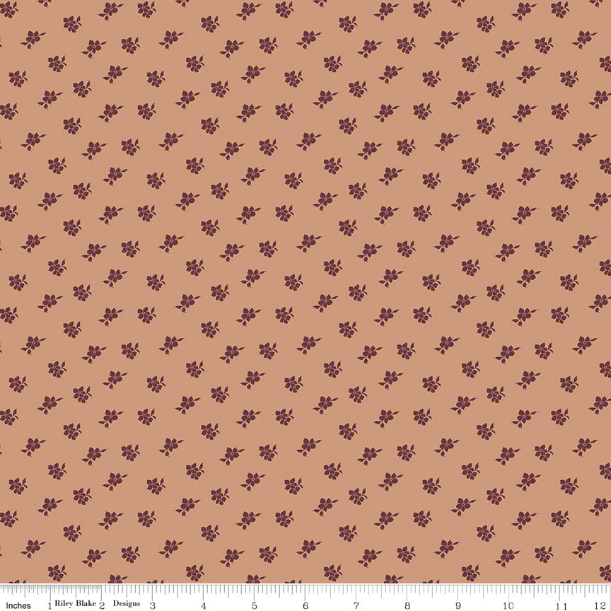 Coral fabric with scattered blossoms.