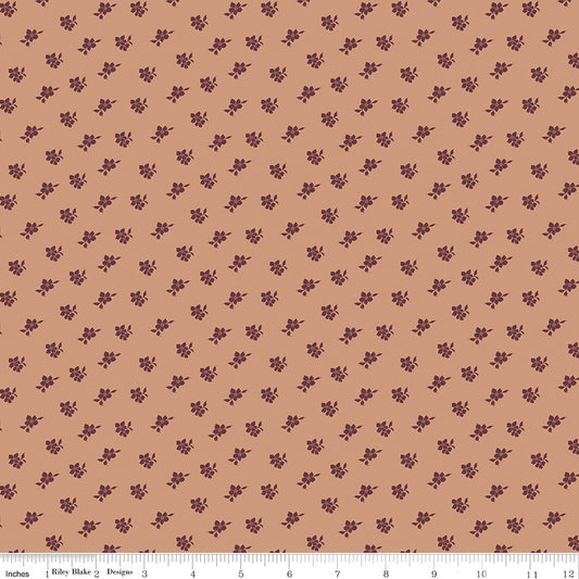 Coral fabric with scattered blossoms.